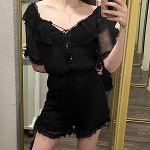 Frilly black romper tie front gothic.